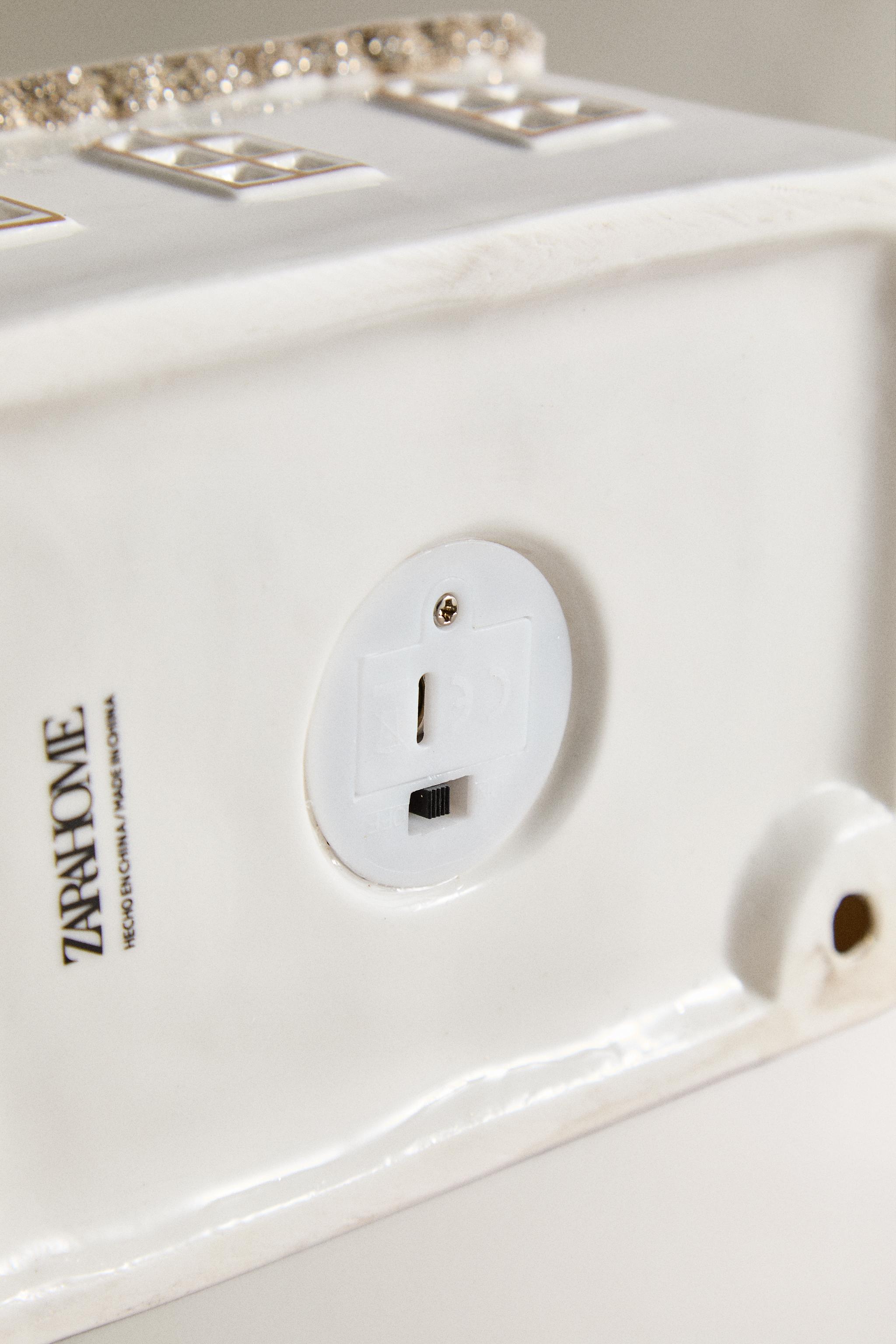 ELONGATED GLITTERY HOUSE CHRISTMAS CERAMIC ORNAMENT